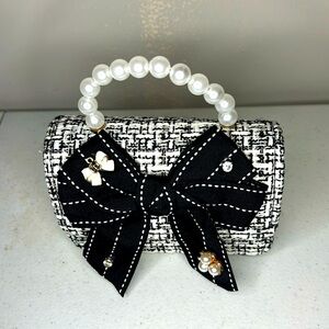 Small purse for girls with faux pearl handle. New with tags